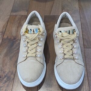 Beige Sneakers with Gold Accents